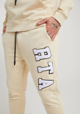 Rta OWEN SWEATPANT | BEIGE COLLEGIATE